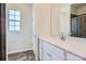 Bright bathroom featuring a sink, vanity, and a tiled shower at 2806 Morning Song Way, Lancaster, SC 29720
