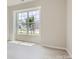Bright bedroom with a large window offering views of the surrounding neighborhood at 2806 Morning Song Way, Lancaster, SC 29720