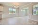 Elegant dining room area with wainscoting, large windows, and a modern chandelier at 2806 Morning Song Way, Lancaster, SC 29720