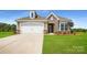 Charming single-Gathering home featuring stone accents, a two-car garage, and a well-manicured front lawn at 2806 Morning Song Way, Lancaster, SC 29720