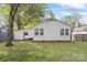 This is the back of a well-maintained house with a spacious yard and mature trees at 288 Fink Nw Ave, Concord, NC 28025