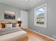 This bedroom has a cozy, relaxing vibe with a comfortable bed and natural light at 288 Fink Nw Ave, Concord, NC 28025