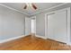 This bedroom features hardwood floors, neutral paint, ceiling fan, and a closet at 288 Fink Nw Ave, Concord, NC 28025