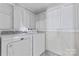 This is an organized laundry room with a new white washer and dryer at 288 Fink Nw Ave, Concord, NC 28025