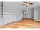 Inviting living room featuring a decorative fireplace, ceiling fan, and hardwood flooring at 288 Fink Nw Ave, Concord, NC 28025