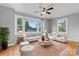Bright living room with large windows, comfortable seating, and stylish decor at 288 Fink Nw Ave, Concord, NC 28025
