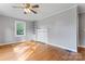 Spacious room with hardwood floors, neutral paint, and built-in shelving at 288 Fink Nw Ave, Concord, NC 28025