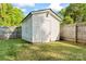 This is a backyard shed with white siding and a secure door at 288 Fink Nw Ave, Concord, NC 28025