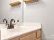 Bathroom featuring a modern sink, and an overhead shelf at 3906 Thomas Ridge Dr, Charlotte, NC 28269