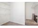 Walk-in closet featuring ample shelving, carpeted floors, and room for storage needs at 3906 Thomas Ridge Dr, Charlotte, NC 28269