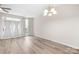 Open-concept dining room features modern flooring, natural light, and neutral color palette at 3906 Thomas Ridge Dr, Charlotte, NC 28269