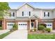 Charming townhome with brick accents, well-manicured landscaping, and a single-car garage at 3906 Thomas Ridge Dr, Charlotte, NC 28269
