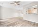 Open layout featuring light colored floors, a view of kitchen appliances, and a spacious living area at 3906 Thomas Ridge Dr, Charlotte, NC 28269