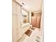 Well-lit bathroom featuring a toilet, shower with curtains, and a marble-top sink at 4223 Willow View Ct, Matthews, NC 28105