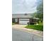 Beautiful brick home with manicured lawn, a two-car garage, and lovely landscaping at 4223 Willow View Ct, Matthews, NC 28105
