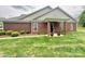 Charming brick home featuring a cozy front porch and well-maintained landscaping at 4223 Willow View Ct, Matthews, NC 28105