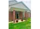 Inviting front porch with brick columns, perfect for relaxing outdoors at 4223 Willow View Ct, Matthews, NC 28105