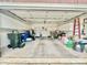 Spacious garage with lots of storage space, a ceiling fan, and overhead lighting at 4223 Willow View Ct, Matthews, NC 28105