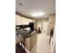 Functional kitchen with white cabinetry, modern appliances, and tile flooring at 4223 Willow View Ct, Matthews, NC 28105