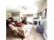 Spacious living room featuring a fireplace, ceiling fan, and laminate flooring at 4223 Willow View Ct, Matthews, NC 28105
