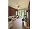 Cozy sunroom with brick walls and tile flooring, plus lots of sunlight at 4223 Willow View Ct, Matthews, NC 28105