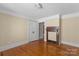 Bedroom featuring hardwood floors and adjacent fireplace at 510 S Carolina Ave, Spencer, NC 28159