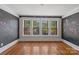 Bedroom featuring hardwood floors and chalkboard walls at 510 S Carolina Ave, Spencer, NC 28159