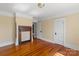 Bedroom features hardwood flooring, fireplace, white trim and neutral paint at 510 S Carolina Ave, Spencer, NC 28159
