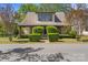 Charming home featuring a dormer window and inviting front porch, nestled amongst manicured trees at 510 S Carolina Ave, Spencer, NC 28159
