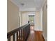 Hallway featuring hardwood floors and trim leading to another room at 510 S Carolina Ave, Spencer, NC 28159