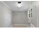 Bright laundry room with tiled floors, neutral paint, and natural light at 510 S Carolina Ave, Spencer, NC 28159