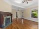 The living room showcases a fireplace with a decorative mantle and hardwood floors at 510 S Carolina Ave, Spencer, NC 28159