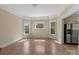 Bright living room with beautiful hardwood floors and natural light from large windows at 510 S Carolina Ave, Spencer, NC 28159