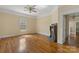 Living room with hardwood floors, neutral walls, fireplace, and natural light from windows at 510 S Carolina Ave, Spencer, NC 28159