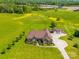 Expansive property with a brick home, detached garage, and rolling green fields under a clear sky at 514 Clover Leaf Rd, Marshville, NC 28103