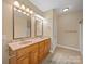 Bathroom featuring double sinks, vanity with drawers and cabinets, with tile flooring at 514 Clover Leaf Rd, Marshville, NC 28103