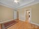 Bright bedroom with hardwood floors, ceiling fan, and neutral paint at 514 Clover Leaf Rd, Marshville, NC 28103