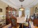 Formal dining room showcases classic details, custom lighting, and plenty of natural light at 514 Clover Leaf Rd, Marshville, NC 28103