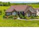 Charming brick home featuring a lush, landscaped front yard with inviting curb appeal at 514 Clover Leaf Rd, Marshville, NC 28103