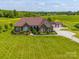 Spacious brick home with an expansive lawn and separate three-car garage, perfect for country living at 514 Clover Leaf Rd, Marshville, NC 28103