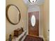 Charming foyer featuring a decorative wood door, classic rug, and elegant accents at 514 Clover Leaf Rd, Marshville, NC 28103