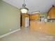Spacious kitchen with ample counter space, wood cabinets, and bright lighting fixtures showcasing modern living at 514 Clover Leaf Rd, Marshville, NC 28103