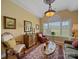 Cozy living room with a sitting area, large window, and decorative accents at 514 Clover Leaf Rd, Marshville, NC 28103