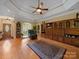 Open-concept living room with ample space, hardwood floors, and a built-in bookcase at 514 Clover Leaf Rd, Marshville, NC 28103
