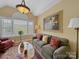 Comfortable living room with a sofa, patterned rug, and plenty of natural light at 514 Clover Leaf Rd, Marshville, NC 28103