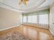 Sun-filled bedroom featuring hardwood floors, crown molding, and large windows offering a bright and airy feel at 514 Clover Leaf Rd, Marshville, NC 28103