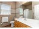 Neutral bathroom includes a window, toilet and single sink at 5283 Fieldstone Dr, Concord, NC 28025