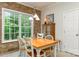 Bright dining area with a wooden table and ample natural light at 5283 Fieldstone Dr, Concord, NC 28025