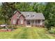 Beautiful brick home with a manicured front lawn and a welcoming front porch at 5283 Fieldstone Dr, Concord, NC 28025