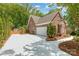 Brick house features a 2-car garage with an extra wide driveway perfect for additional parking at 5283 Fieldstone Dr, Concord, NC 28025